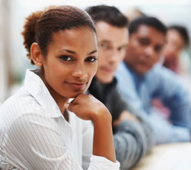 Black business woman in conference with associates