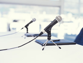 two microphones on a table close up